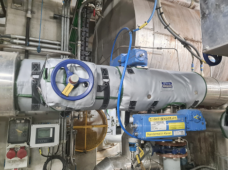 Steam control valve and isolation valve insulated with removable, reusable blanket insulation (jacket insulation) on steam supply line.