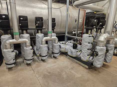 Boiler feedwater pump station with removable reusable blanket insulation (jacket insulation) on valves, strainers and fittings